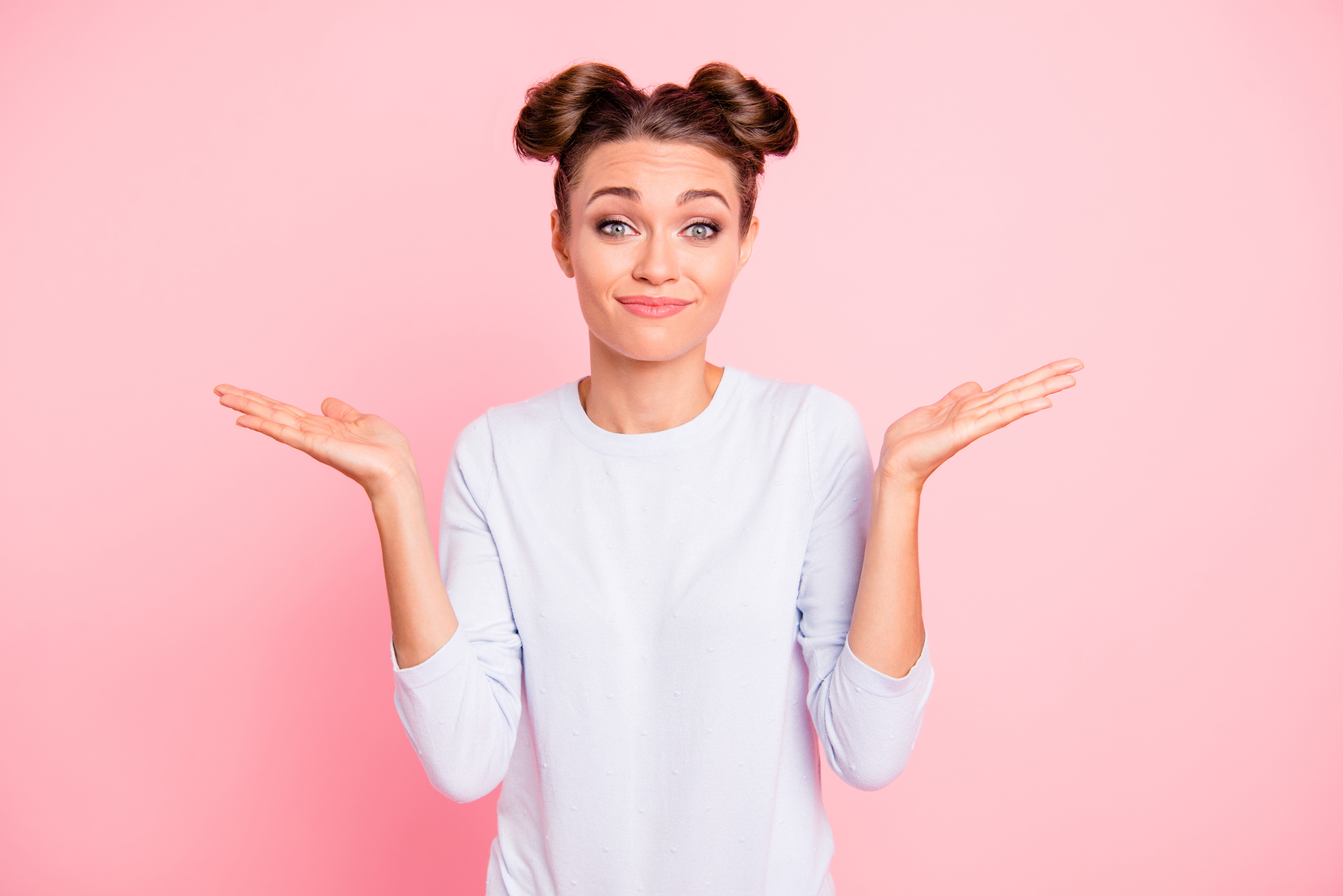 Portrait of nice-looking cute attractive winsome lovely funny cheerful cheery girl showing I don't know why what who when no idea gesture isolated over pink pastel background